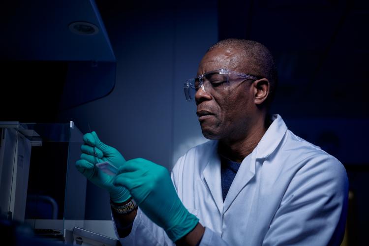 Researcher using biocore and loading samples