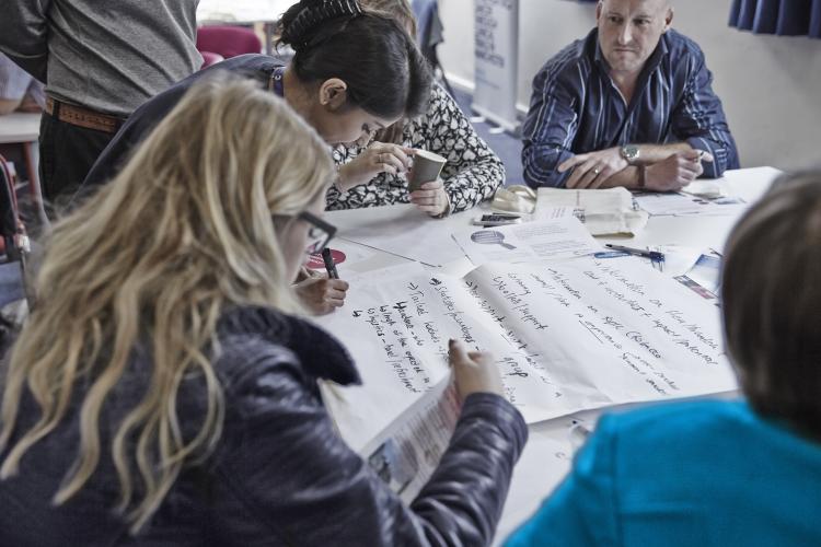 Researchers collaborating in workshop