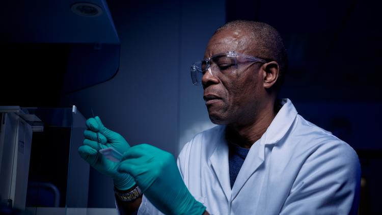 Researcher using biocore and loading samples
