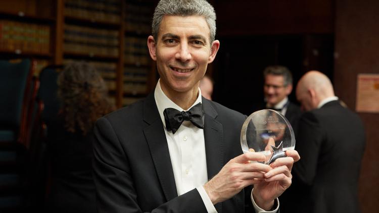 Nitzan Rosenfield holding an award
