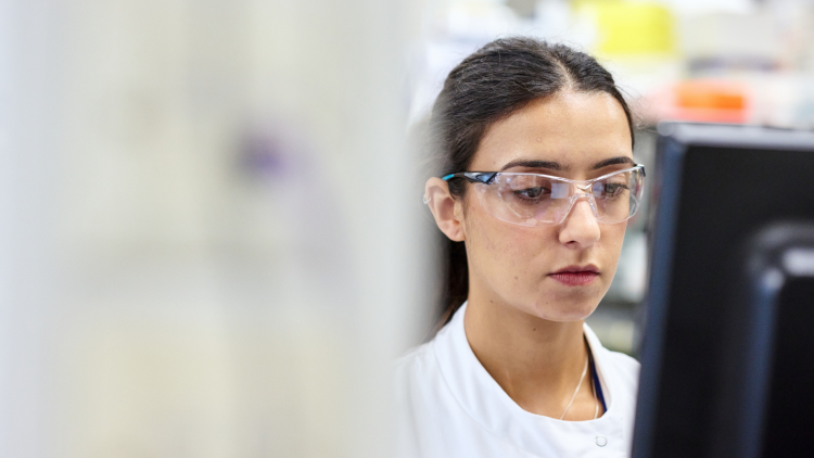 Scientist looking at computer screen