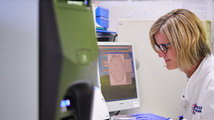 Scientist looking at computer screen