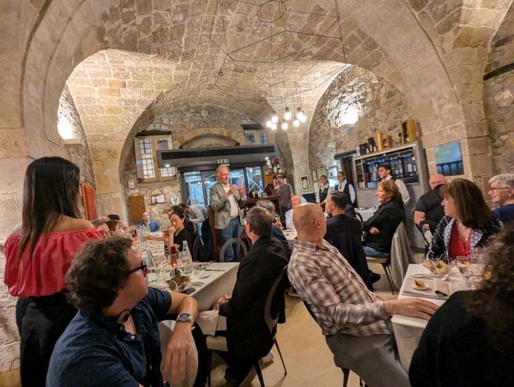 Eureka participants in a restaurant with a vaulted ceiling