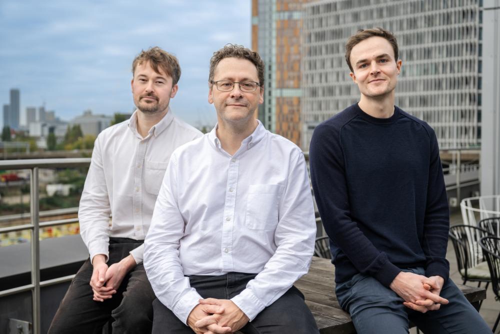 The Siftr Bio co-founders, Archie Wall, Ed Tate and Dan Lucy, on a roof in London.