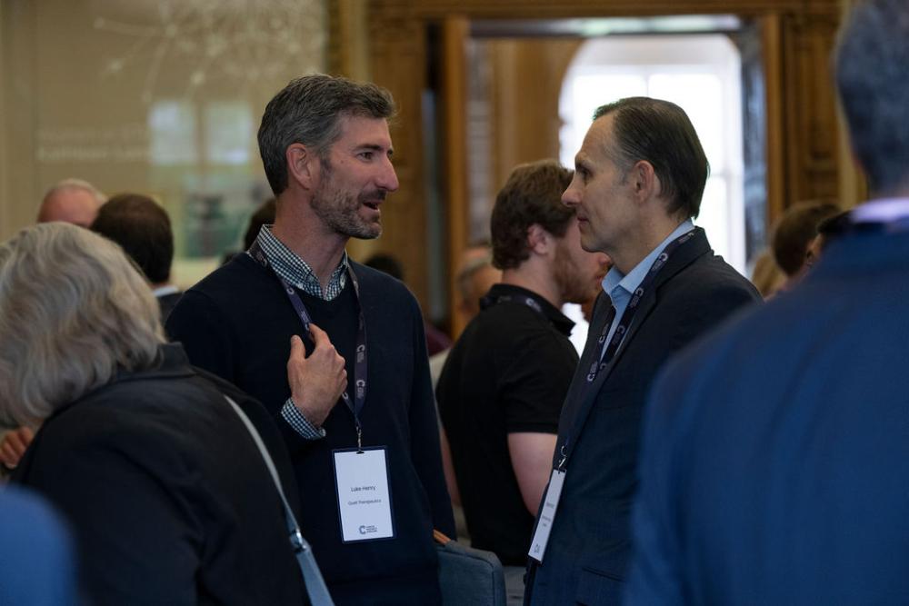 Two people networking at a conference