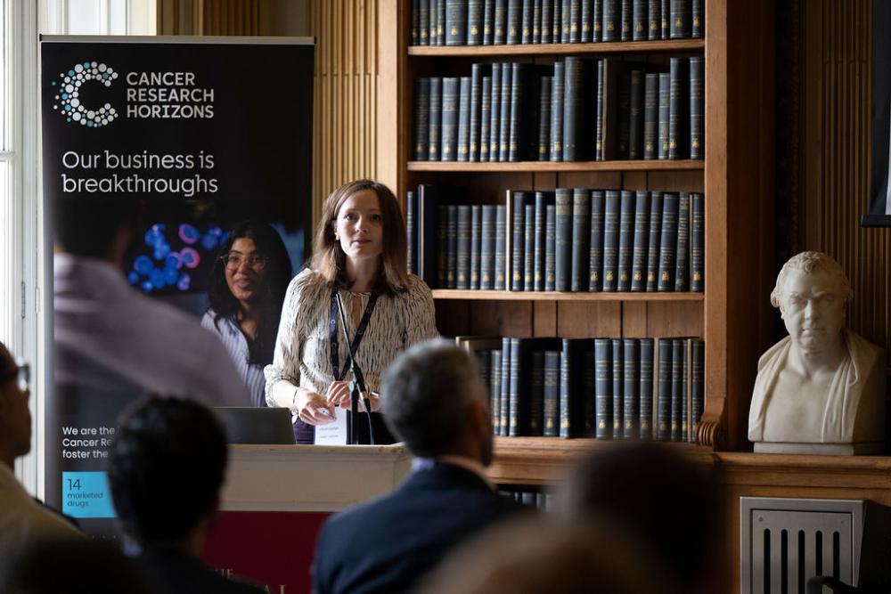 Olivia Cavlan speaks at a lectern