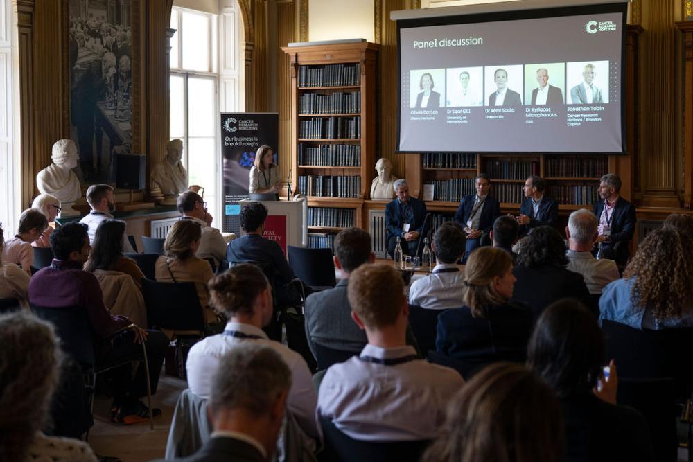 An audience watches a presentation at the Royal Society